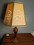 Copper Colored Metal Table Lamp, Stenciled & Pierced Floral Paper Shade. Fixed Price $39.00.