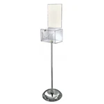Azar Displays Large Clear Lottery Box With Pocket, Lock And Keys On Pedestal. Fixed Price $91.58.