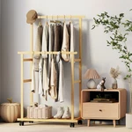 Wooden Double Rods Clothes Stand On Wheels With Trousers Rack & Bottom Shelf. Fixed Price $33.96.