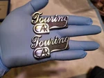 2 Brand New Touring Car Emblem Letters Logo Badge Metal Chrome Stick On. Fixed Price $20.00.